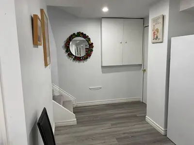 a hallway with a christmas wreath on the wall at Large Separate Entrance Basement Unit 2Beds 1Washroom Sleeps 4-6 in Pickering
