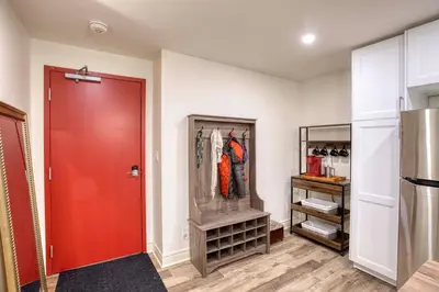 a walk in closet with a red door at Rustic Elegant Stays in Niagara Benchlands in Beamsville