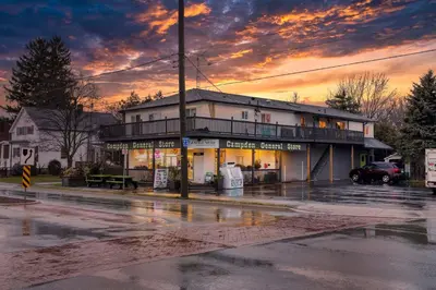 a building on a city street with a sunset at Rustic Elegant Stays in Niagara Benchlands in Beamsville