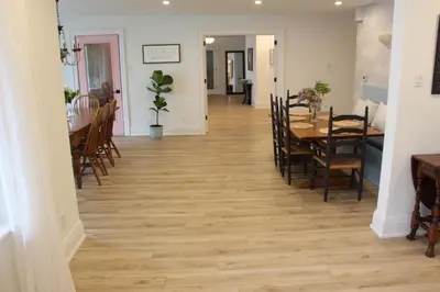 a hallway with a dining room and a table and chairs at Waterfront Boutique Accommodation in PEC - Suite 3 in Belleville
