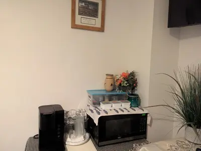 a kitchen with a toaster oven and a microwave at Honey Dew in Bowmanville