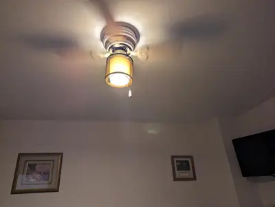 a ceiling fan with a light on a ceiling at Honey Dew in Bowmanville