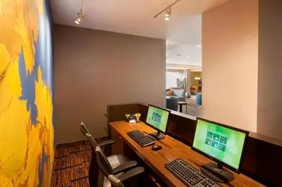 an office cubicle with two computer monitors on a desk at Courtyard by Marriott Toronto Northeast/Markham in Markham