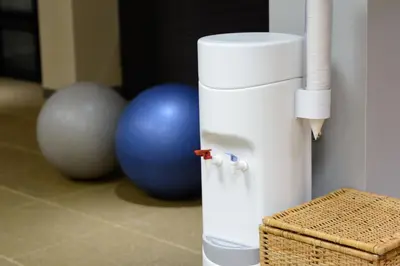a white water cooler sitting next to two exercise balls at Courtyard by Marriott Toronto Northeast/Markham in Markham