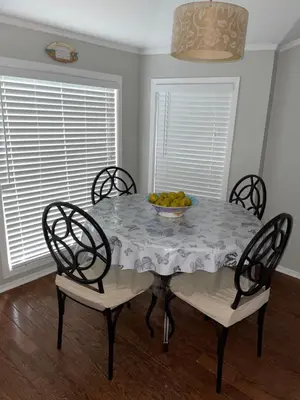 a dining room table with a bowl of fruit on it at Swing Bridge Cottage on Lake Simcoe - Waterfront in Brechin