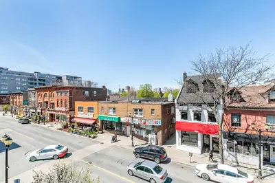 a city street with cars parked on the street at 1BR Basement Condo - James Street in Hamilton