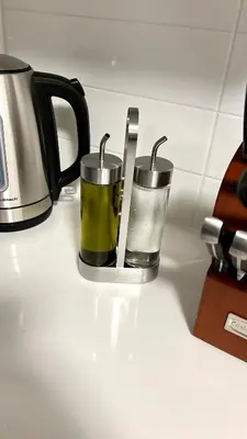 two cups sitting on a kitchen counter with a coffee pot at Niagara Getaway across Fallsview in Niagara Falls