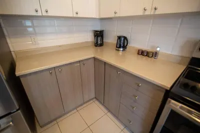 a kitchen with a counter with a coffee maker on it at Townhome Steps From Lake Ontario in Hamilton