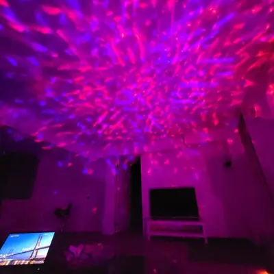 a room with pink and purple lights on the ceiling at Bright 2 Bedroom Basement Apartment in Angus in Angus