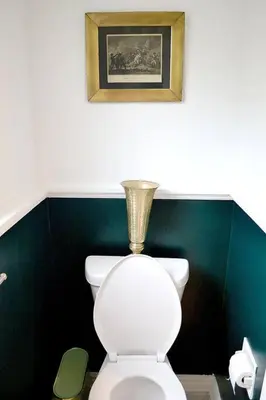 a bathroom with a toilet with a vase on top of it at Cellar House NOTL - Entire Home in the Heart of Niagara-on-the-Lake in Niagara on the Lake
