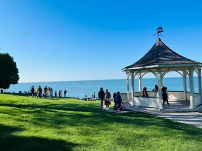 people walking around a gazebo at the beach at Barker House 1# Suite-heart of oldtown in Niagara on the Lake