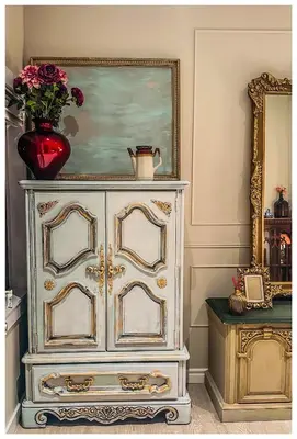 a white dresser with a vase on top of it at Cozy Place on Main Floor in Toronto