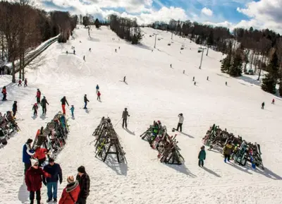 a group of people on a snow covered ski slope at Waterfront Haliburton, All Season, Fully Equipped Cottage! in Haliburton