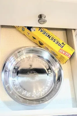 a metal bowl in a drawer with a box at Cozy Home in Niagara-on-the-Lake in Niagara on the Lake