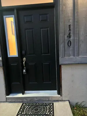 a black door on a building with the number forty on it at LaVida Exclusive Guest House (Rm #3) in London