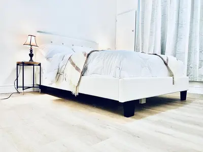 a white bed in a white room with a lamp at LaVida Exclusive Guest House(Rm#4) in London