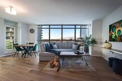 a living room with a dog laying on the floor at Downtown Toronto Condo Parking Sleeps 4 Balcony Walk to Lake in Toronto