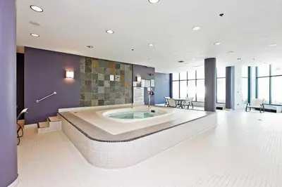a large bathroom with a large tub in the middle at Downtown Toronto Condo Parking Sleeps 4 Balcony Walk to Lake in Toronto