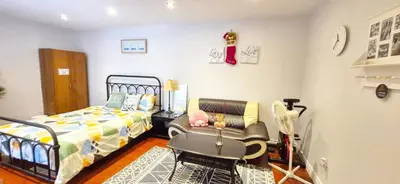 a bedroom with a bed and a chair in it at Toronto Spacious Cozy Mainfloor Room in Toronto
