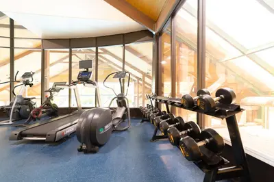 a gym with a bunch of exercise bikes in a room at Horseshoe Valley Suites - The Maple in Shanty Bay