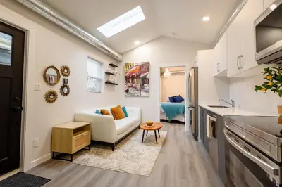 a living room with a couch and a table at Victoria's Lookout in London