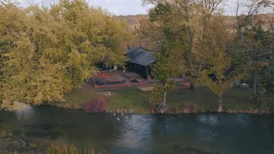 an aerial view of a house next to a river at The June Motel, Beaver Valley in Kimberley