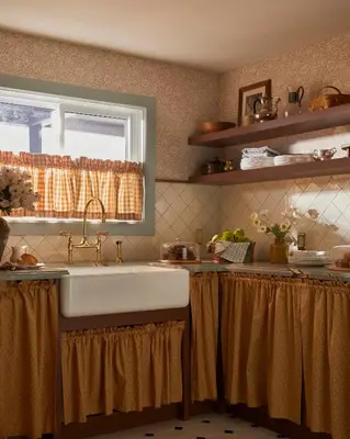 a kitchen with a sink and a window at The June Motel, Beaver Valley in Kimberley