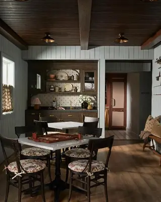 a dining room with a table and chairs at The June Motel, Beaver Valley in Kimberley