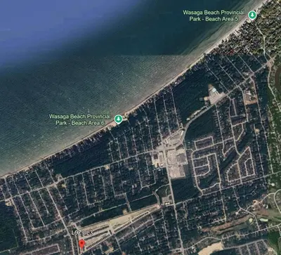 an aerial view of a beach next to the water at Beatrice Beach House in Wasaga Beach