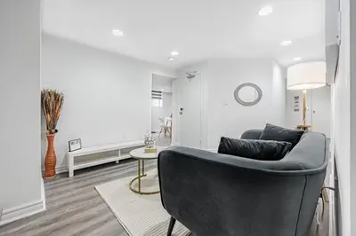 a living room with a couch and a table at Cozy Haven Retreat 2Bed Basement in Whitby