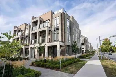 a rendering of a large apartment building on a street at Luxe Toronto Townhome, Rooftop Terrace, Parking in Toronto