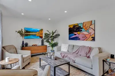 a living room with a couch and a table at Dorado at The Kabins by The Falls in Fenelon Falls