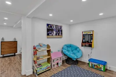 a room with a playroom with a chair and a table at Dorado at The Kabins by The Falls in Fenelon Falls