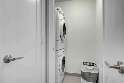 a white washer and dryer in a bathroom at CN lovers in Toronto
