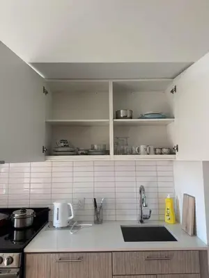 a kitchen with a sink and a counter top at Cozy holiday home in Toronto