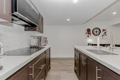 a kitchen with a sink and a counter top at Luxury Basement Apartment in Oakville Monthly stays only in Oakville
