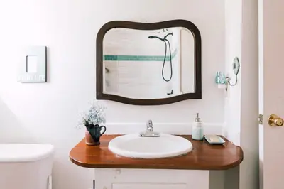 a bathroom with a sink and a mirror at County Escape on Corey in Bloomfield