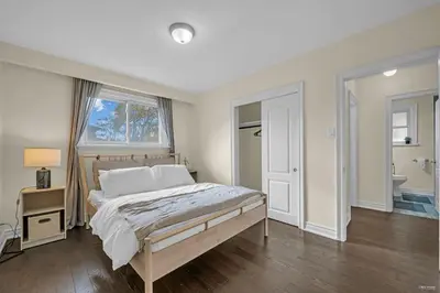 a bedroom with a bed and a window at Luxury Renovated House in Prime Location with Parking in Toronto