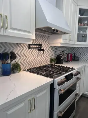 a kitchen with a stove and white cabinets at Luxury Oakville Home, Hot Tub, Fireplace, New Home in Oakville