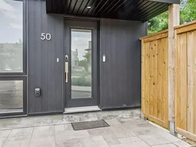 a house with a speed limit sign on the door at Luxury Resort Villa in Muskoka in Gravenhurst