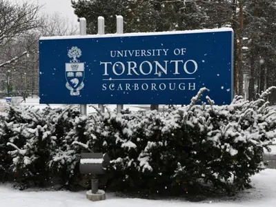 a sign for the university of toronto in the snow at Stylish 2BR: w/free parking & streaming! in Pickering