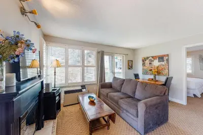 a living room with a couch and a table at Steps to the Hill 1 Bedroom CraveTV in Blue Mountains