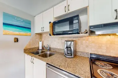 a kitchen with a sink and a microwave at Steps to the Hill 1 Bedroom CraveTV in Blue Mountains