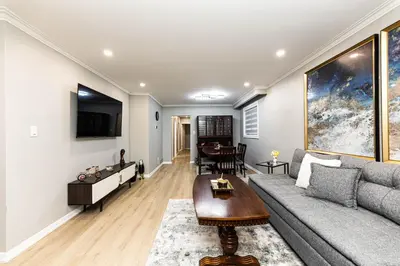 a living room with a couch and a table at Matilda’s Luxury House in Mississauga