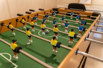 a model of a soccer game with players on a court at 6min To Niagara Falls - 4 Free Parking - Foosball in Niagara Falls