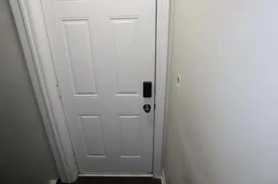 a white door in a white room with at Stunning Furnished 2 Bedroom 2 Washroom Basement Apartment in Brampton