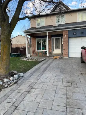 a driveway in front of a house at Comfortable Stay In Beautiful Home in Milton