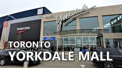a car parked in front of a car dealership at Executive Room in Toronto next to Yorkdale shopping centre in Toronto