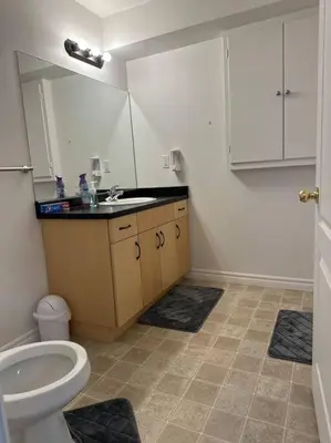 a bathroom with a sink and a toilet at Luxury Spacious 5-Bedroom Home in London