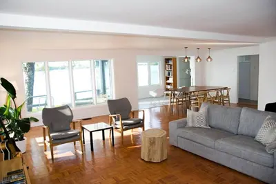 a living room with a couch and chairs and a table at Heaven on Huycks Bay in Hillier